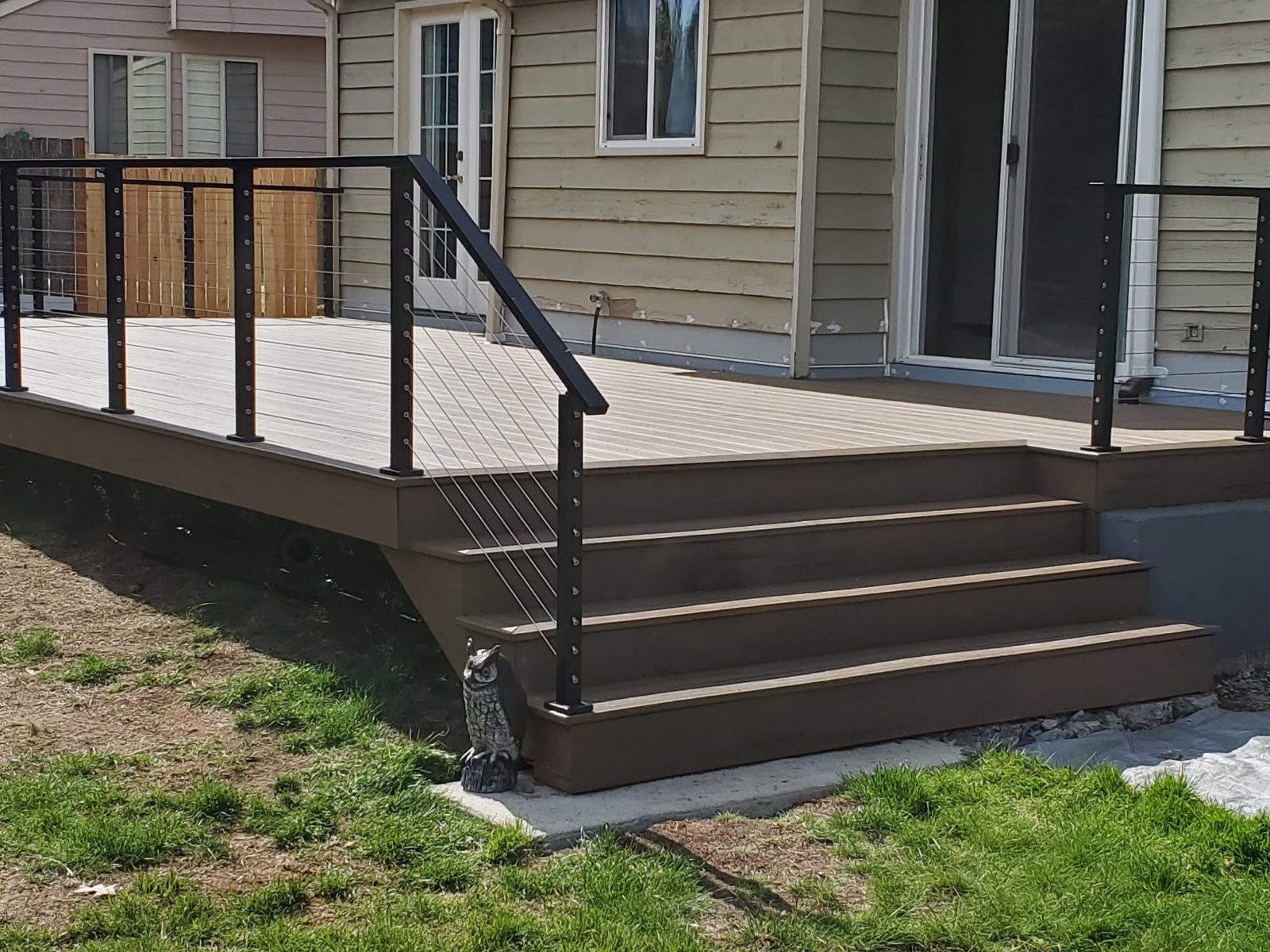 New composite deck with black cable railing
